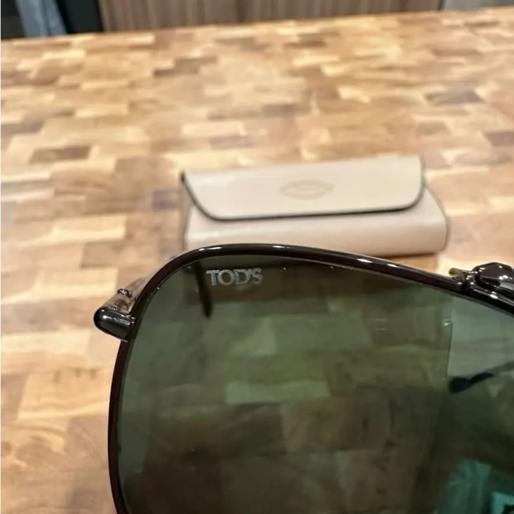 Tod's Black Frame Sunglasses with Dark Green Lenses